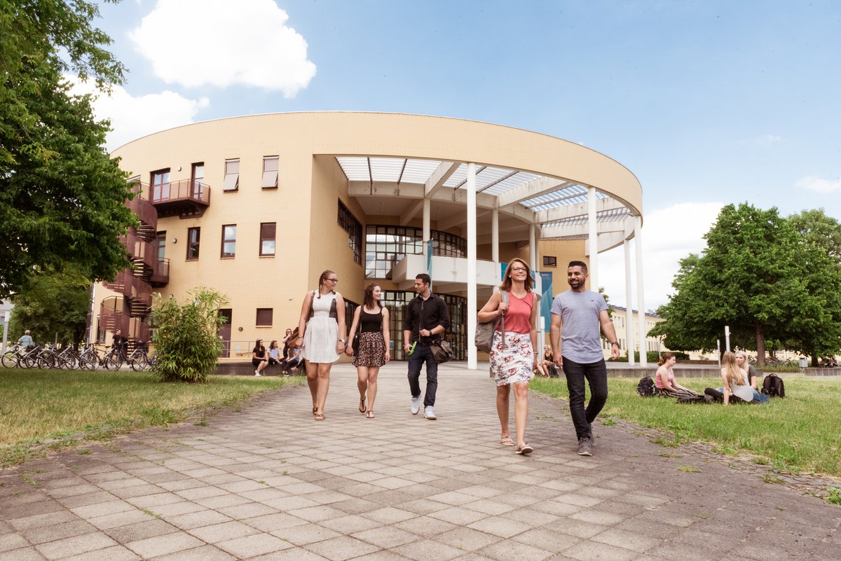 Students at Campus Senftenberg in front of the Konrad Zuse Media Center