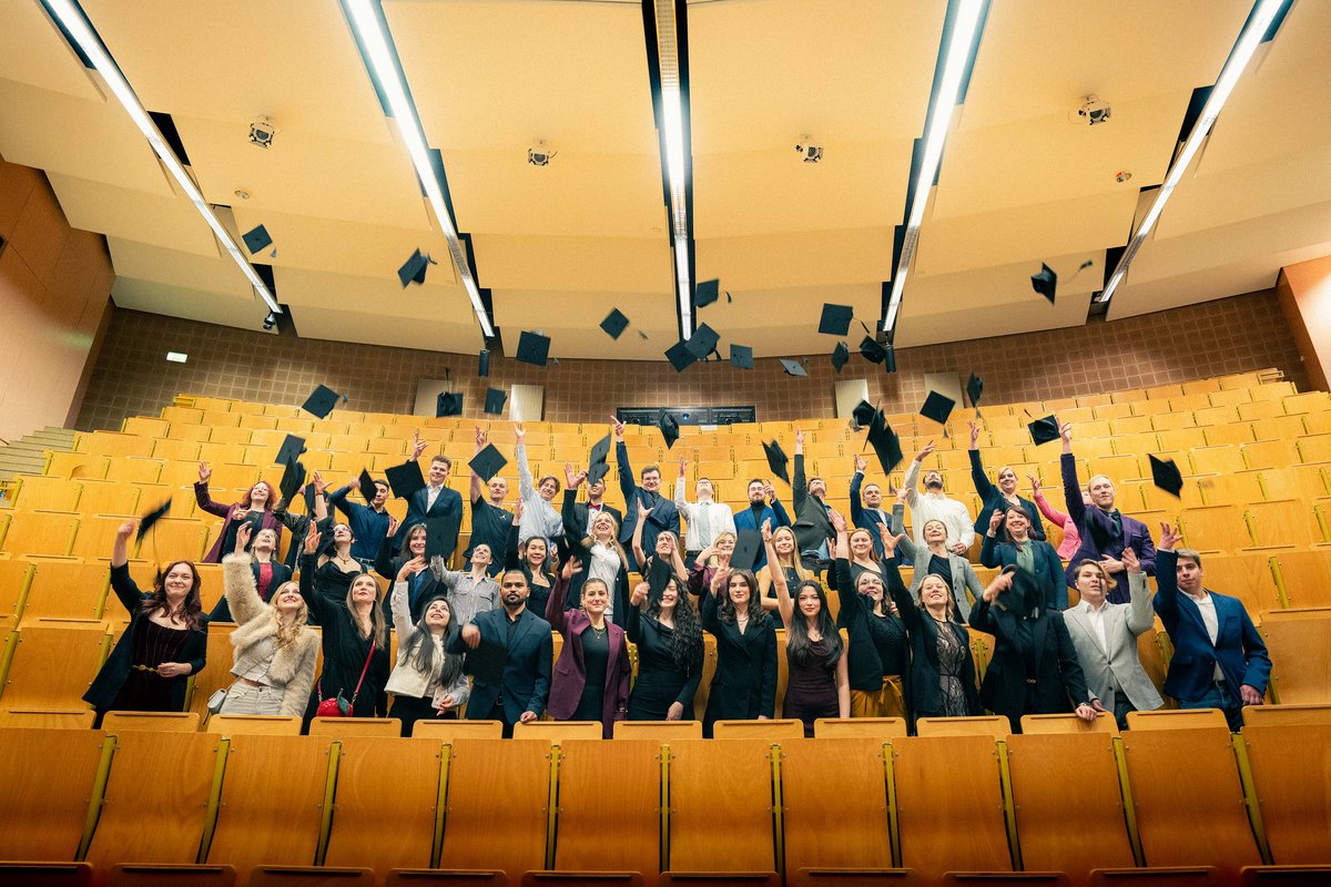 Graduates throw up their graduate hats