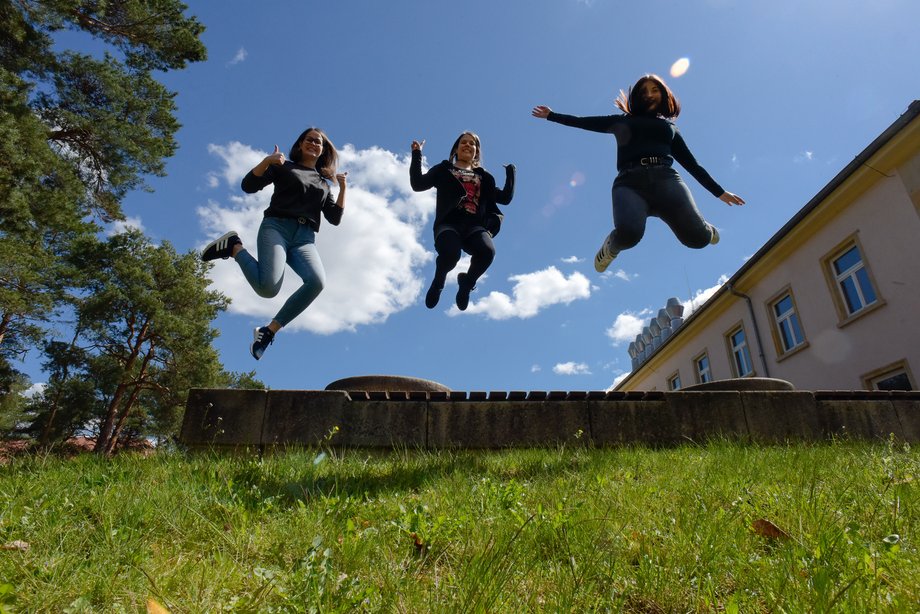social worker students jump on campus sachsendorf