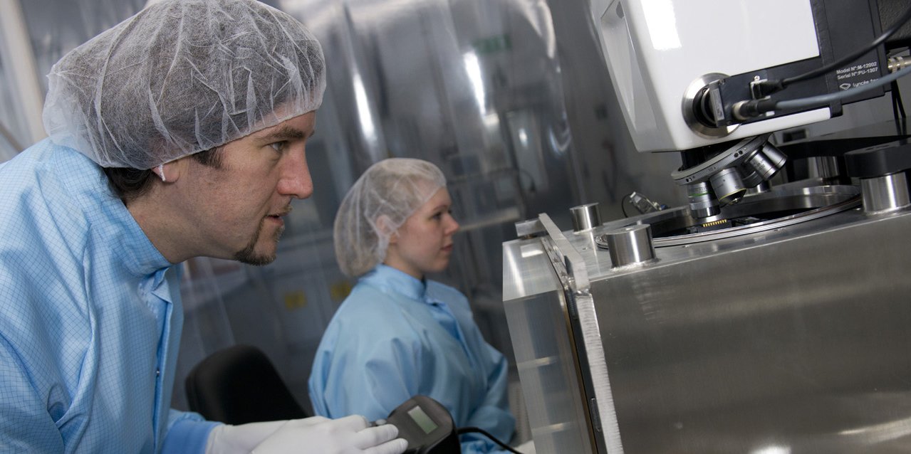 Scientists set up a microscope in the physics laboratory