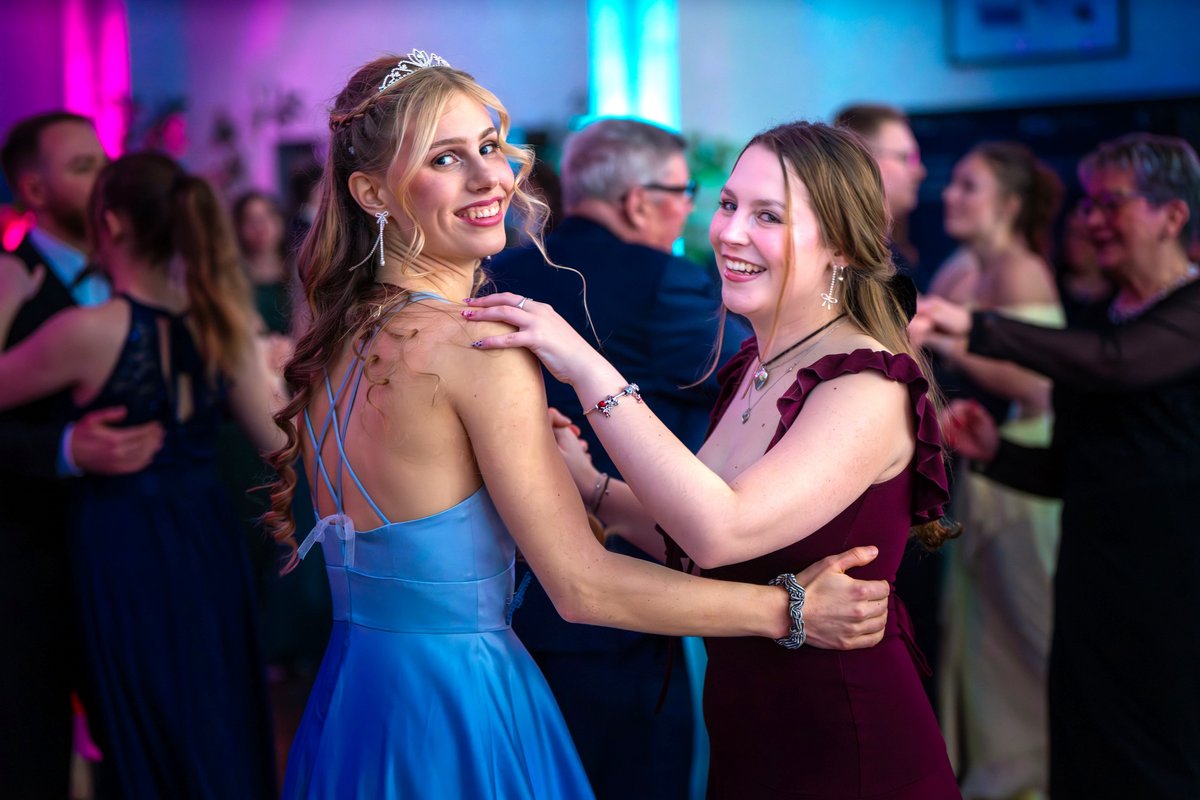 Happy dancing couples on the dance floor.