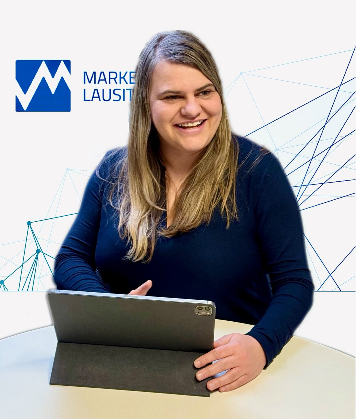 Maria Erdmann sits in front of the marketing logo