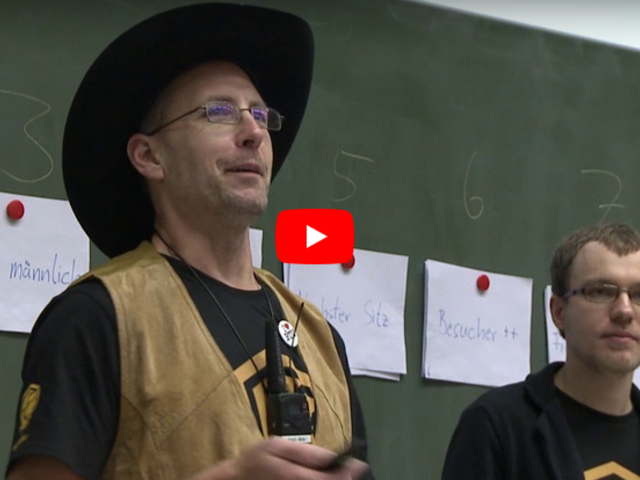 Videothumbnail der Vortrags. Zu sehen Werner Haas (l.) und Thomas Prescher.