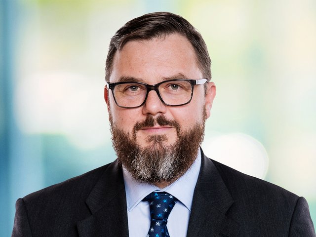 Porträtfoto von Dr. André Lehmann.