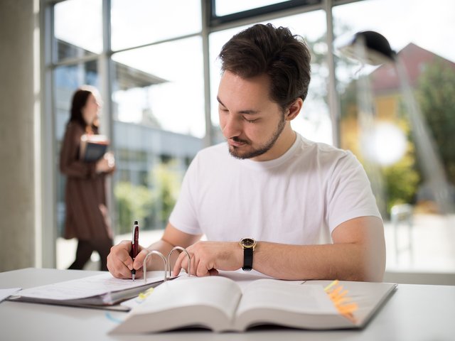 Young man at his desk. 