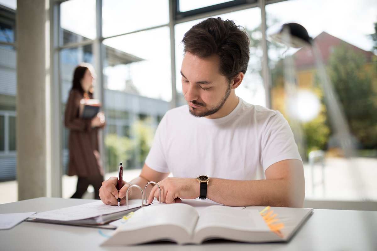 Young man at his desk. 