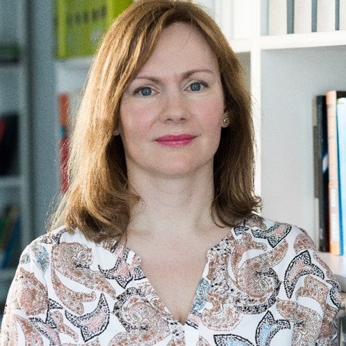 woman in front of an office background