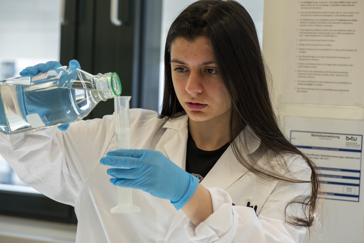 Student fills a test tube.