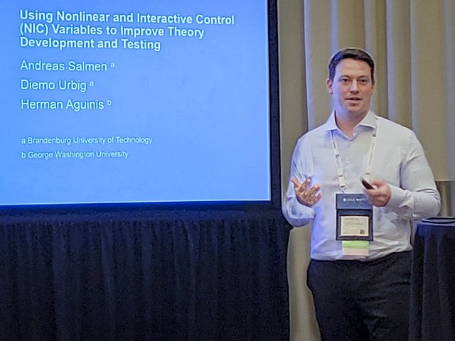 BTU doctoral candidate Andreas Salmen gives explanations as part of his presentation at the 84th Annual Meeting of the AOM in Chicago.
