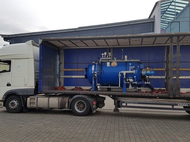 Blue autoclave loaded onto the truck