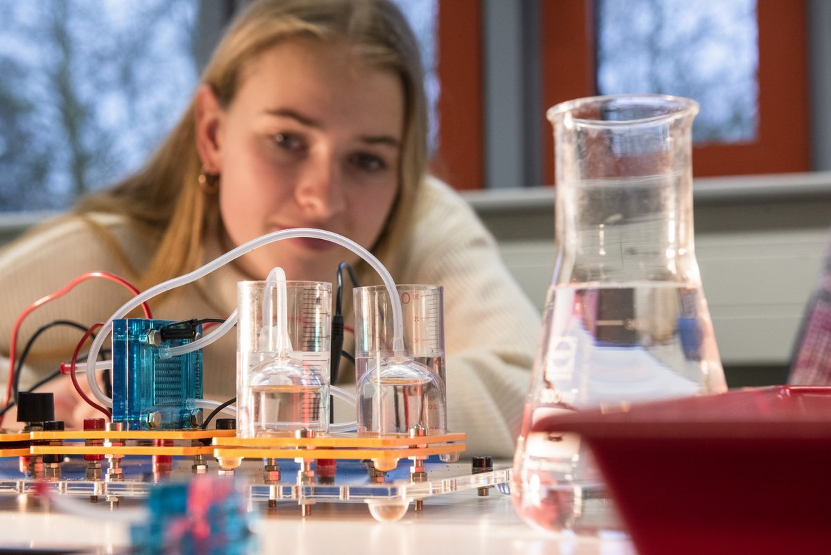 A student tests electrical circuits.