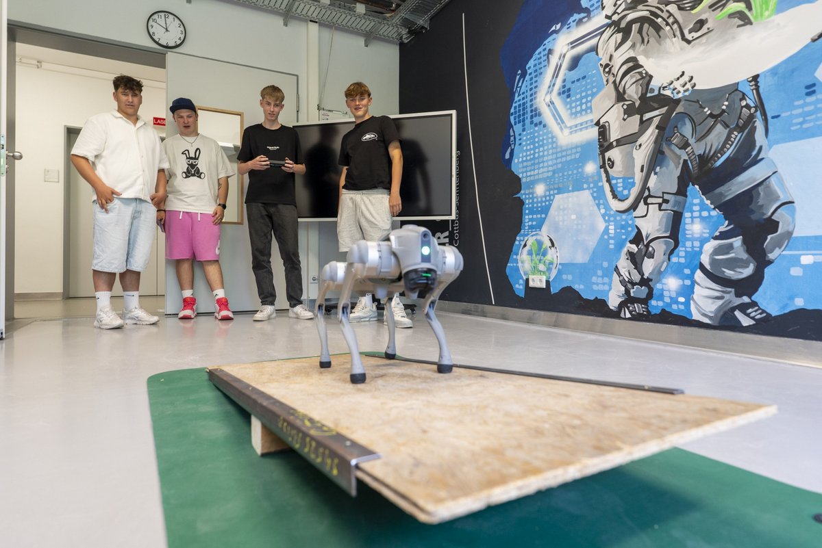 Pupils control Robohund over a seesaw.