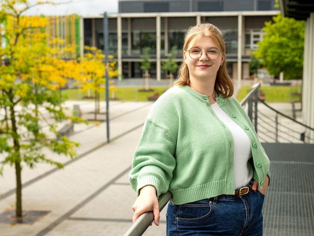 The first graduate of BTU's new Medical Engineering study programme, Marlene Felker, stands on the university's main campus. 