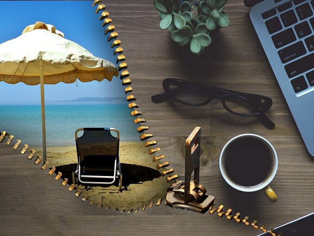 photo of beach and workplace with laptop
