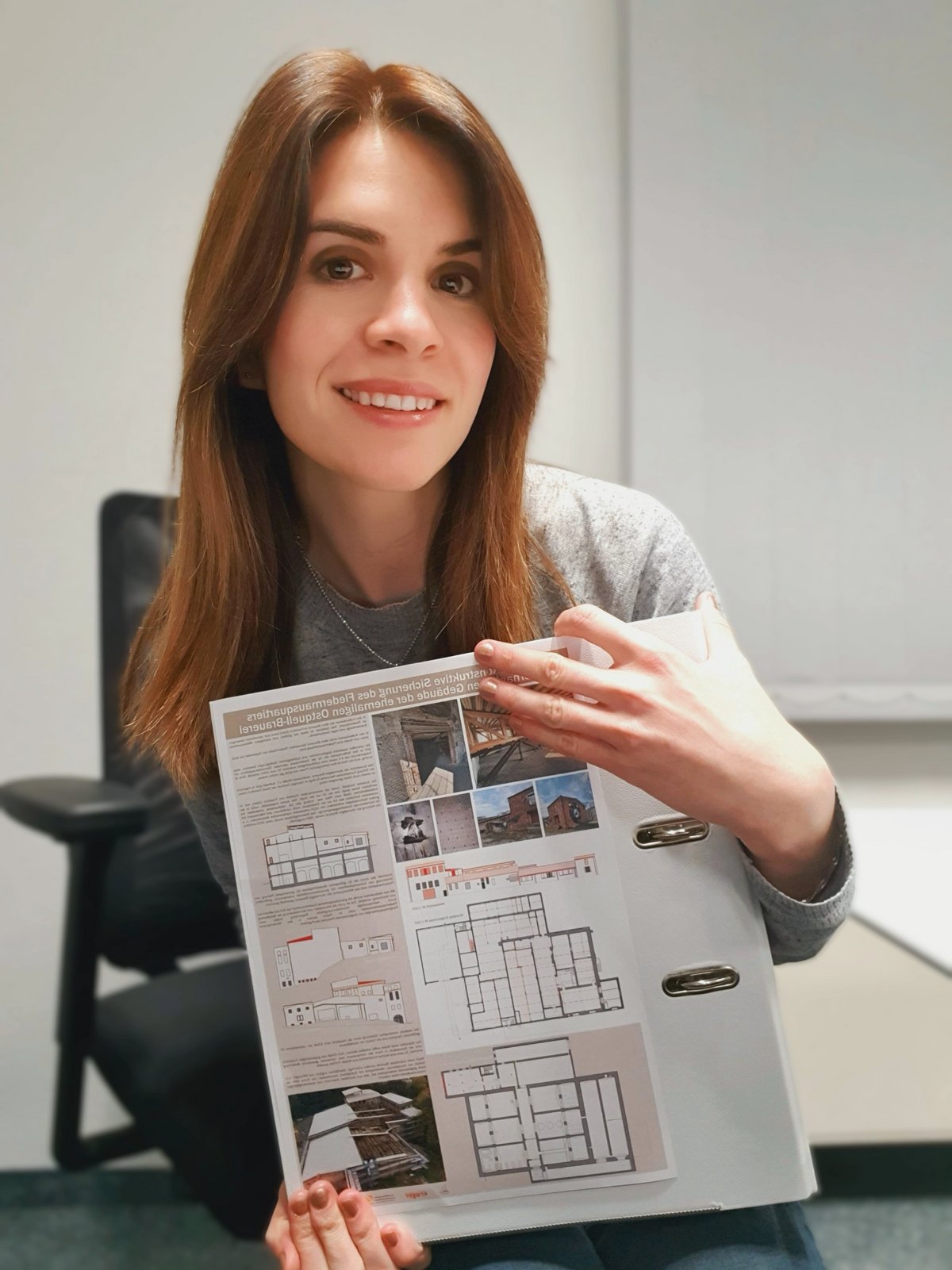 Liudmila with construction magazine in hand