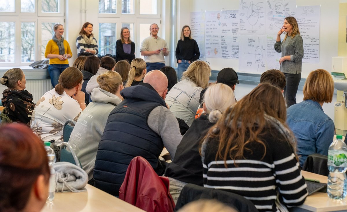 Prospective students follow a lecture. 