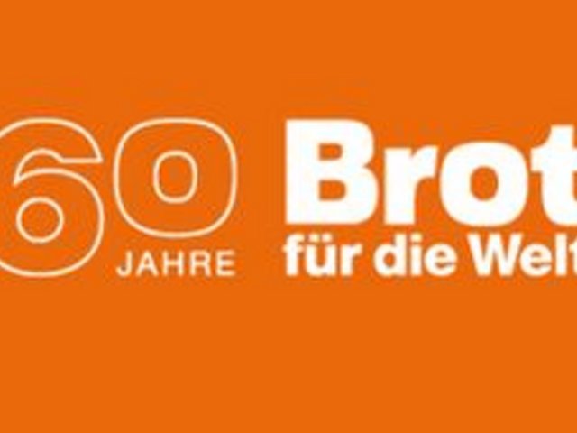 Weiße Schrift auf orangem Grund