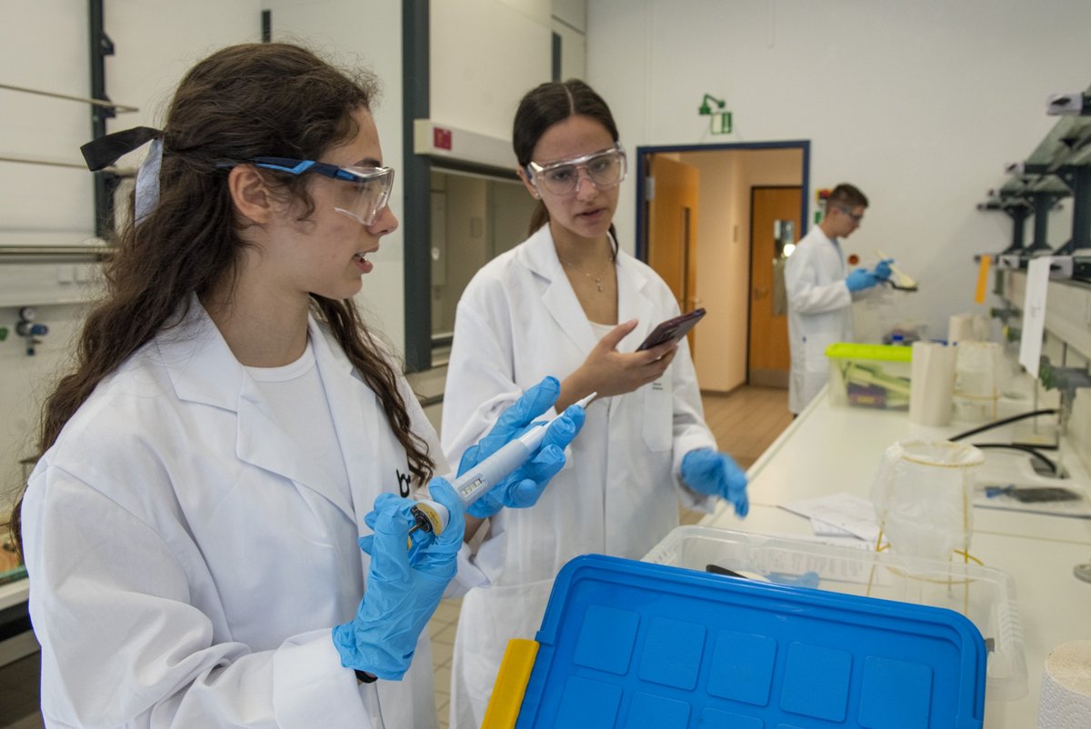 Schoolgirls experimenting in the lab.