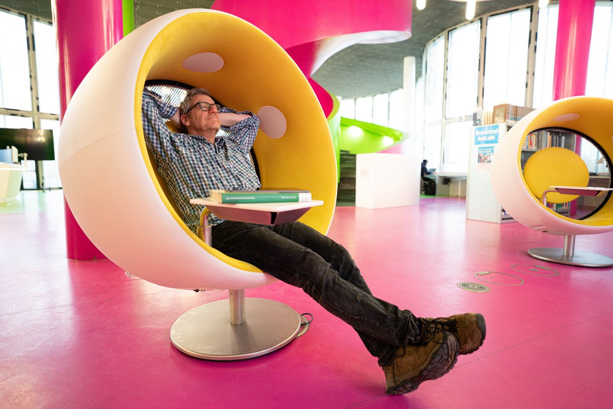 Man sitting relaxed in an armchair.