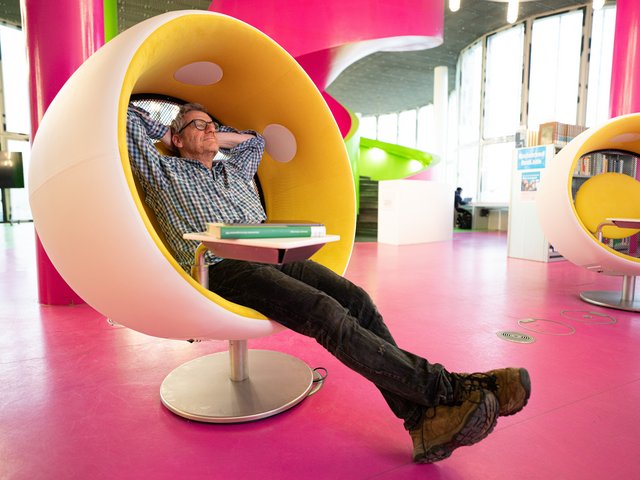 Man sitting relaxed in an armchair.