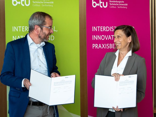 The representatives of both institutions after the signing with the contract in hand