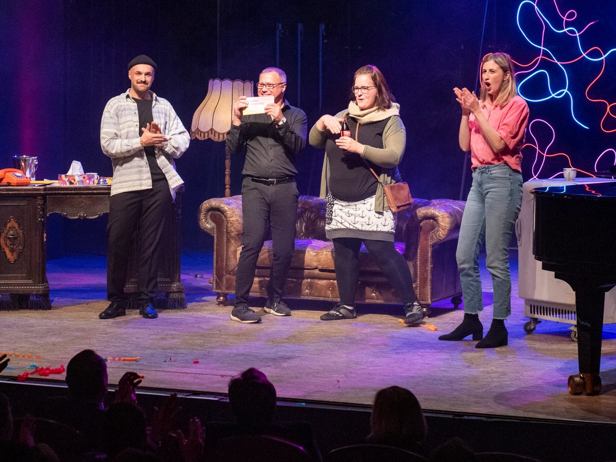 Four people on the theater stage. Photo: BTU, Ralf Schuster