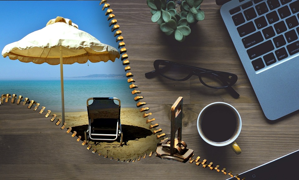 photo of beach and workplace with laptop