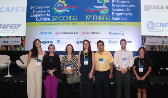 Presenters of the Keynotes Presentations standing next to each other in front of the sign for the 24th Brazilian Conference on Chemical Engineering 